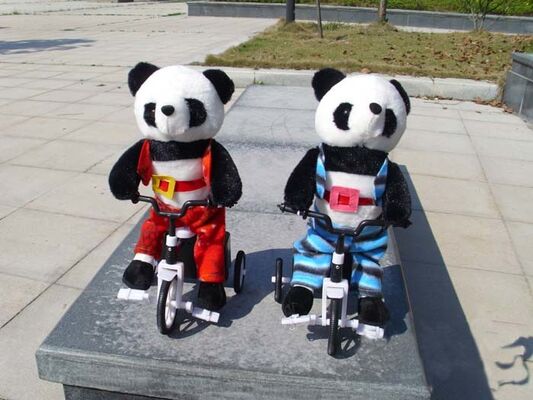 100% pp. Baumwollmusikalische Plüsch-Spielwaren, elektronischer Fahrrad-Tierpanda-weiches Spielzeug