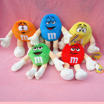 Der M&M-Plüschtier-Karikatur-Plüsch der Kinder spielt gelber freundliches Eco
