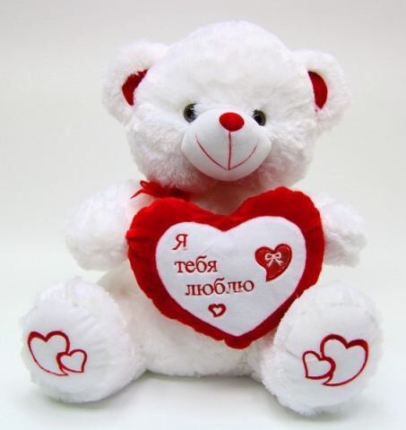 Der reizende Valentinsgruß-Tag angefüllt spielt kleinen weißen Plüsch-Teddybären für Prämie